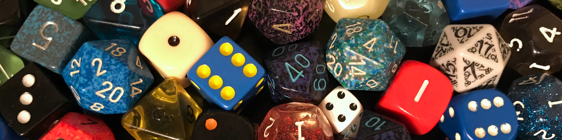 A number of different polyhedral dice.