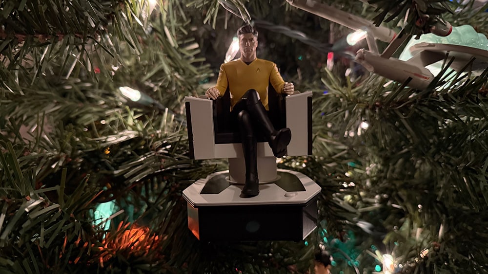 Captain Pike of the Enterprise (and Strange New Worlds), sitting in his command chair.