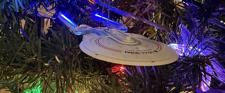 The Enterprise 1701-B, illuminated by Christmas Lights from the Geek Tree.