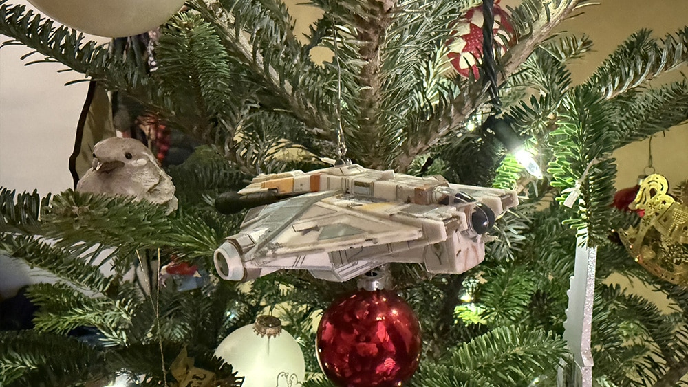 The Ghost, from Star Trek Rebels, hiding among the green needles of a real Christmas Tree.